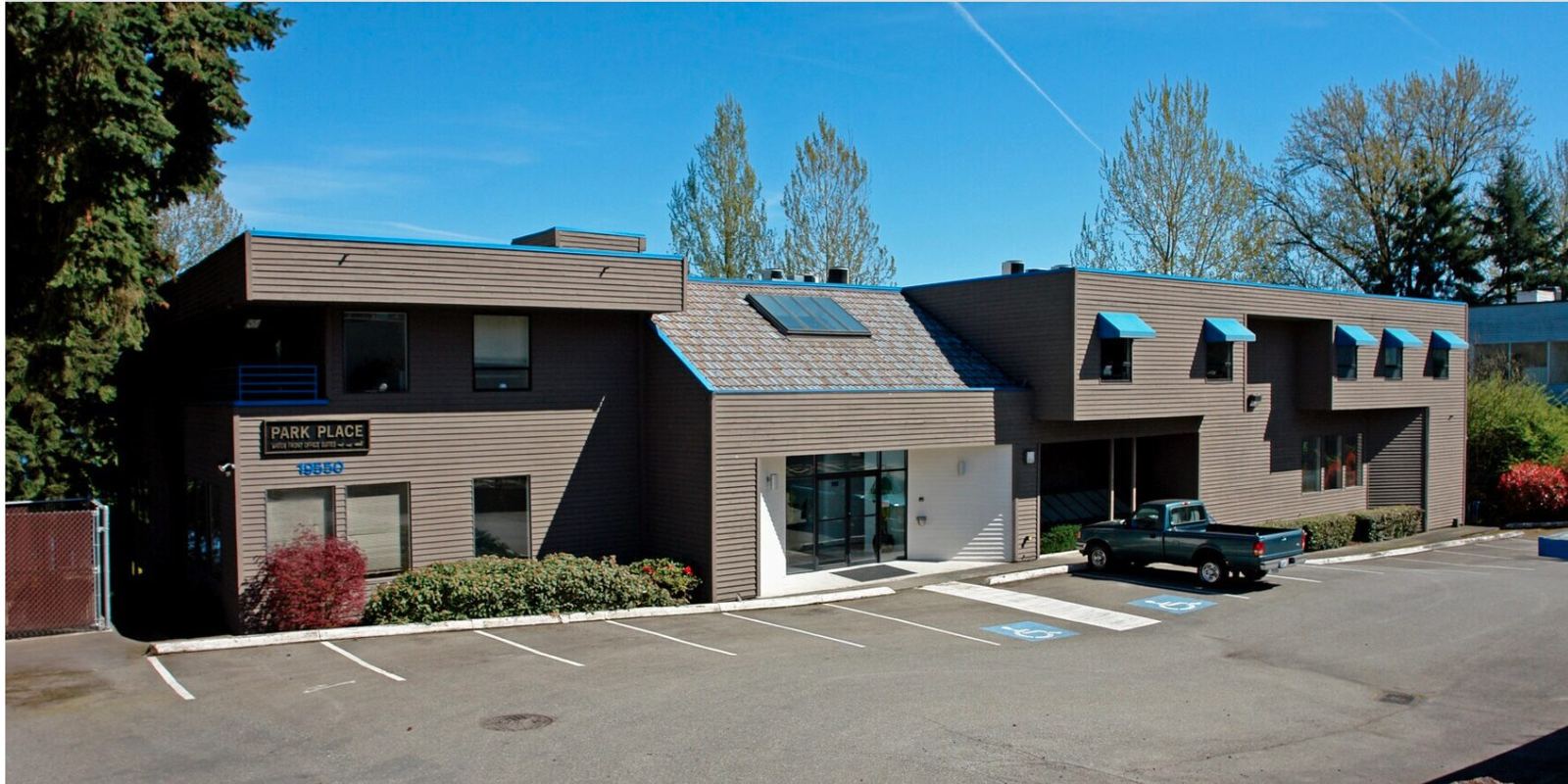 Park Place Plaza — the front entrance and on-site parking, set back from International Boulevard.